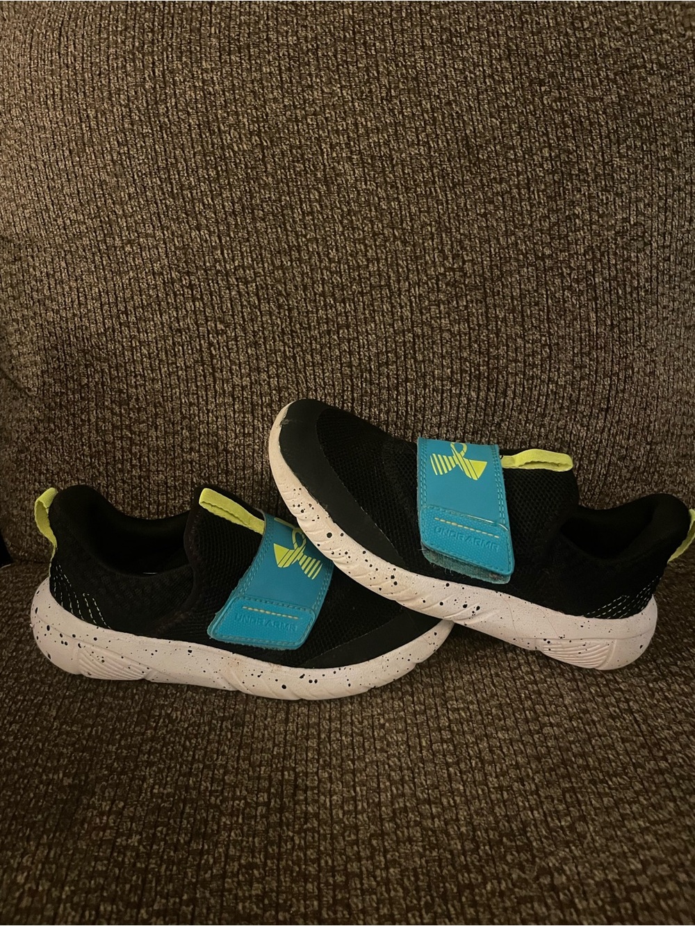 Kids Under Armour Black Athletic Sneakers with Blue Strap and Neon Accents